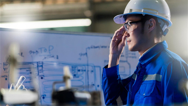 male asian engineer professional having discussion standing by machine factory two asian coworker brainstorm explaining solves process curcuit mother board machine